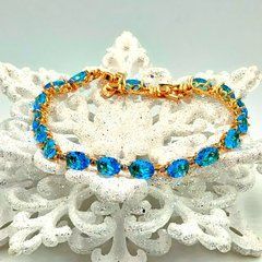 Браслет XUPING 47841.Позолота 18K. Голубие циркони.